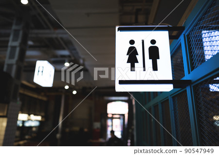 Toilet sign for male and female on the wall Toilet sign for male and female on the wall 90547949