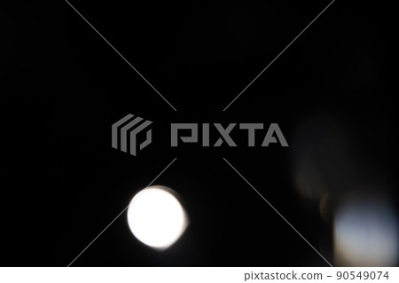 Blue light flare prism rainbow flares overlay effect on black background, light crossing crystals, prismatic sun catcher reflections rays. Abstract blurred colourful lens flare bokeh on dark 90549074