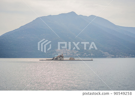 St George Island in the Bay of Kotor at Perast in Montenegro, with St George Benedictine Monastery. St. George Island, is a small natural island off the coast of Perast in Bay of Kotor, Montenegro St George Island in the Bay of Kotor at Perast in Montenegro, with St George Benedictine Monastery. St. George Island, is a small natural island off the coast of Perast in Bay of Kotor, Montenegro 90549258