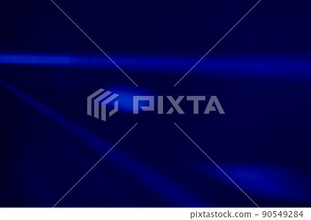 Blue light flare prism rainbow flares overlay effect on black background, light crossing crystals, prismatic sun catcher reflections rays. Abstract blurred colourful lens flare bokeh on dark 90549284