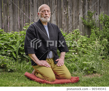 senior man sitting in a traditional Japanese seiza position senior man sitting in a traditional Japanese seiza position 90549341