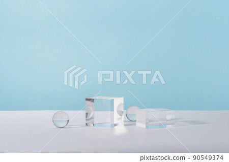 Pedestal cosmetic display glass podium platform with stylish props for product presentation, cosmetics geometric stand, mockup scene for jewellery mock up. Acrylic blocks and balls on blue Pedestal cosmetic display glass podium platform with stylish props for product presentation, cosmetics geometric stand, mockup scene for jewellery mock up. Acrylic blocks and balls on blue 90549374