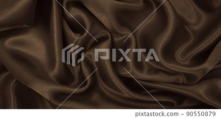 Smooth elegant brown silk or satin luxury cloth texture as abstract background. Luxurious background design wallpaper. In Sepia toned. Retro style Smooth elegant brown silk or satin luxury cloth texture as abstract background. Luxurious background design wallpaper. In Sepia toned. Retro style 90550879