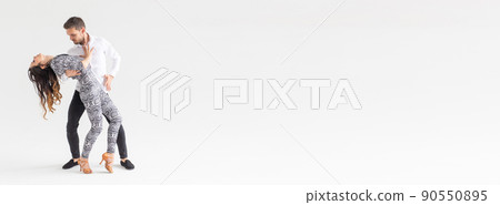 Banner couple dancing latin dance bachata merengue salsa kizomba. Two elegance pose over white background with copy space Banner couple dancing latin dance bachata merengue salsa kizomba. Two elegance pose over white background with copy space 90550895