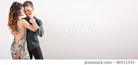 Banner social dance bachata kizomba tango salsa concept - Young couple dancing over white background with copy space Banner social dance bachata kizomba tango salsa concept - Young couple dancing over white background with copy space 90551543