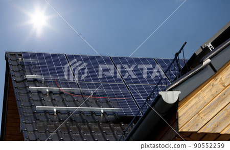 Demonstration of the installation of solar panels on the roof of a house. Metal mounting, construction. Demonstration of the installation of solar panels on the roof of a house. Metal mounting, construction. 90552259