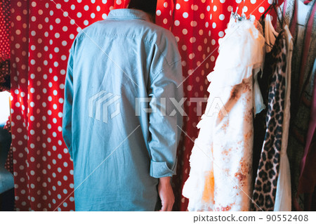 Portrait of a young man sleeping exhausted and thrusting his face into the closet Portrait of a young man sleeping exhausted and thrusting his face into the closet 90552408