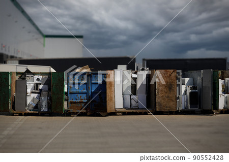 Electronic waste discarded pending transport to recycling facility for further processing. Electronic waste and copy-space. 90552428