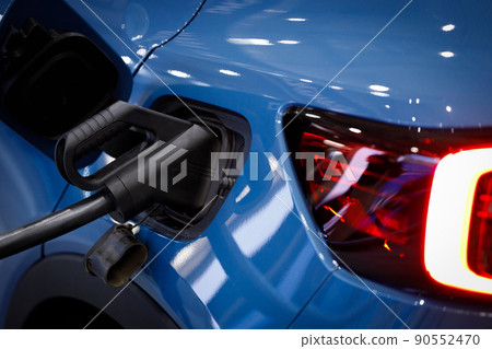 Electric car charging battery energy in station. Electric car charging battery energy in station. 90552470