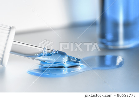 Pipette with fluid serum, oil, face gel cleaner. Cosmetics and healthcare concept closeup. Dose of retinol with air bubbles. Flat lay. Monkeypox, coronavirus research Pipette with fluid serum, oil, face gel cleaner. Cosmetics and healthcare concept closeup. Dose of retinol with air bubbles. Flat lay. Monkeypox, coronavirus research 90552775