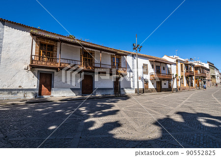 Teror at Gran Canaria, Spain. A beautiful traditional town with colorful houses with wooden balconies 90552825