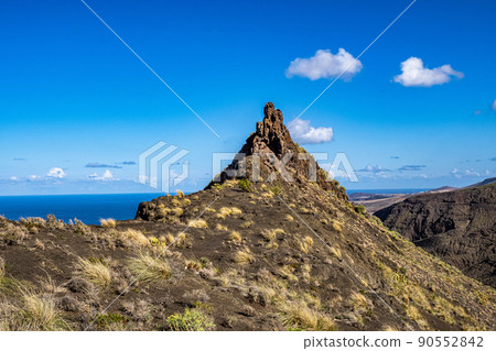 The finger of god, rock formation on the coast of Agaete, Roque Guayedra, Gran Canaria, Spain The finger of god, rock formation on the coast of Agaete, Roque Guayedra, Gran Canaria, Spain 90552842