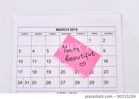 March calendar and sticker note with you are beautiful handwriting. March calendar and sticker note with you are beautiful handwriting. 90553284