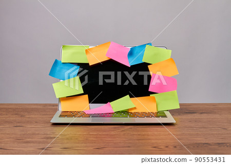 Open laptop with many colorful sticker notes for copy space. Open laptop with many colorful sticker notes for copy space. 90553431