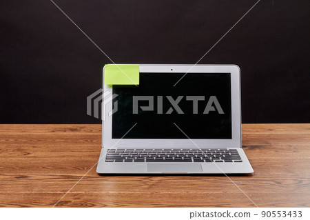 Macbook air laptop and attached sticky note for copy space. Macbook air laptop and attached sticky note for copy space. 90553433
