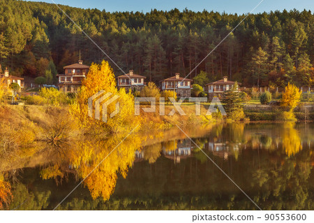 Autumn landscape with lake and houses, Bulgaria 90553600
