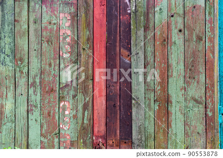 Background from wooden strips of different colors. Painted wooden background. Multicolored background. Background from wooden strips of different colors. Painted wooden background. Multicolored background. 90553878