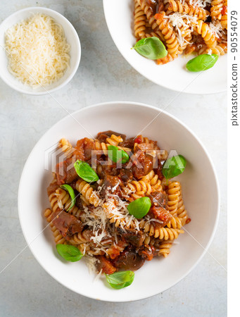 Pasta alla Norma - traditional Italian food with eggplant, tomato, cheese and basil Pasta alla Norma - traditional Italian food with eggplant, tomato, cheese and basil 90554079