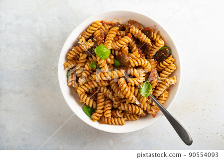 Pasta alla Norma - traditional Italian food with eggplant, tomato, cheese and basil Pasta alla Norma - traditional Italian food with eggplant, tomato, cheese and basil 90554093