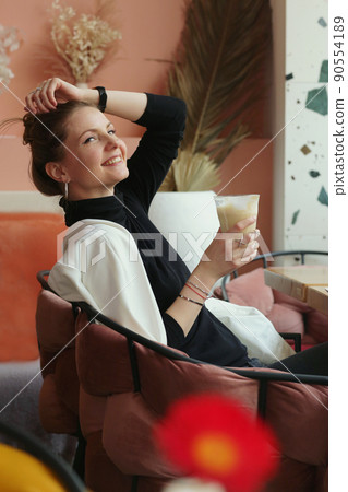 young blond business woman on lunch in cafe drinking latte coffee closeup photo young blond business woman on lunch in cafe drinking latte coffee closeup photo 90554189