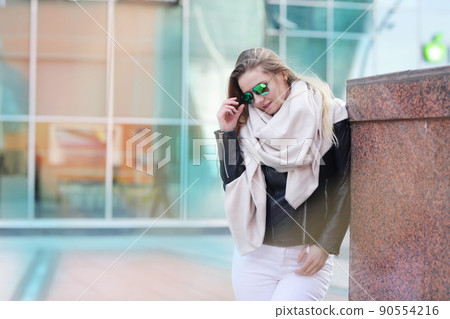 blond girl with long hair in black leather jacket closeup street portrait blond girl with long hair in black leather jacket closeup street portrait 90554216