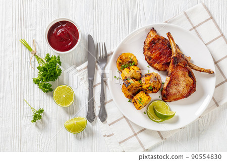 roast tomahawk pork chop with corn disks roast tomahawk pork chop with corn disks 90554830