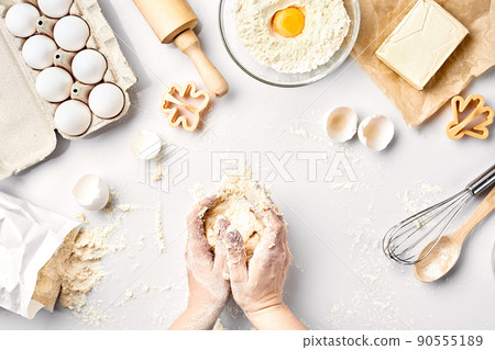 Baker preparing to knead the dough, top view. Cooking, bakery concept 90555189