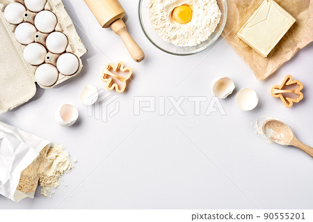 Baking ingredients for pastry on the white table Baking ingredients for pastry on the white table 90555201