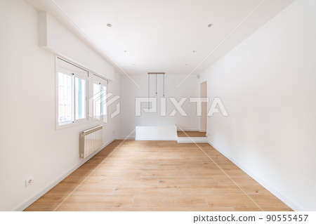 Empty apartment room with wooden floor in a new flat for rent Empty apartment room with wooden floor in a new flat for rent 90555457