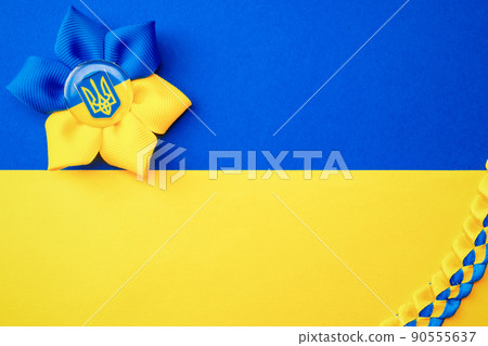 Ukraine symbol yellow background. Ukrainian flower trident symbol isolated on yellow blue flag. Solidarity Ukraine concept. Ukraine symbol yellow background. Ukrainian flower trident symbol isolated on yellow blue flag. Solidarity Ukraine concept. 90555637