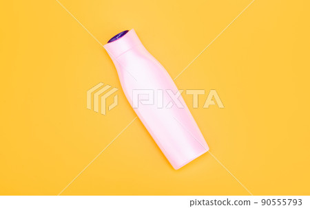 white shampoo bottle on yellow background, skincare 90555793