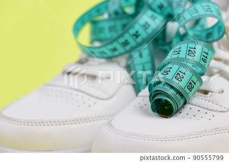 Fitness, sport, diet and healthy lifestyle banner with sneakers Fitness, sport, diet and healthy lifestyle banner with sneakers 90555799