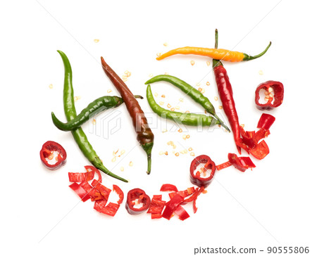 Vegetables and vegetarian diet concept. Chopped chili peppers Vegetables and vegetarian diet concept. Chopped chili peppers 90555806