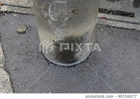 Utility poles discolored by dog markings and gutters peeed Utility poles discolored by dog markings and gutters peeed 90556077