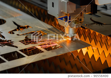 Laser cutting machine working with sheet metal with sparks Laser cutting machine working with sheet metal with sparks 90556400