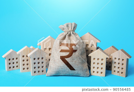 Indian rupee money bag among town houses figurines. Realtor services. Sale of real estate. property taxes. Tax collection, investment in city development. Municipal budgeting. Rental business. Indian rupee money bag among town houses figurines. Realtor services. Sale of real estate. property taxes. Tax collection, investment in city development. Municipal budgeting. Rental business. 90556485