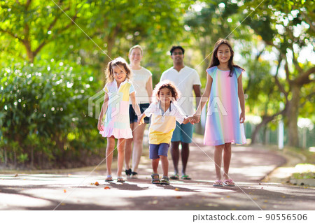 Family in summer park. Parents and kids outdoor. 90556506