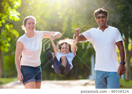 Family in summer park. Parents and kids outdoor. 90556524