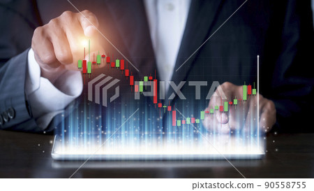 Hand of businessman use tablet analysis stock market graph growth and increase of chart positive indicators. Hand holding tablet show stock chart. Financial business stock market concept 90558755