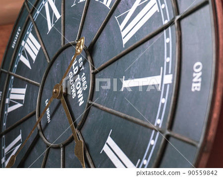 Old wall clock made of wood and iron. The big one was taken out at some point. to see some needles and symbols Focus on some points, cinematic tones, shot in the studio. 90559842
