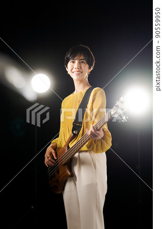Female guitarist vertical position Female guitarist vertical position 90559950