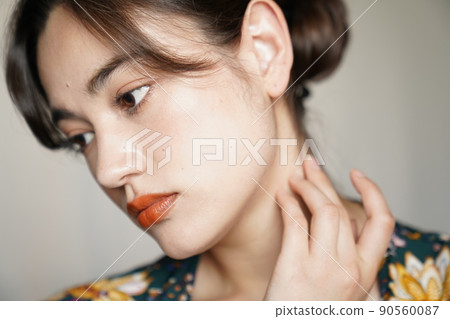 Up-style woman in a floral gown Up-style woman in a floral gown 90560087