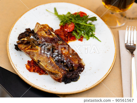 Appetizing meat dish Terrine of pork ears and kidneys with red pesto sauce 90561567
