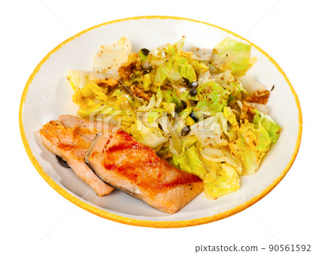 Grilled salmon steak with fresh lettuce salad 90561592