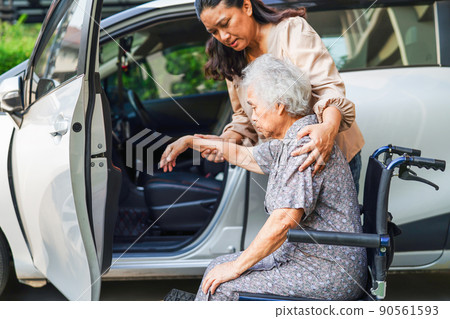 Caregiver help Asian elderly woman disability patient get in her car, medical concept. Caregiver help Asian elderly woman disability patient get in her car, medical concept. 90561593