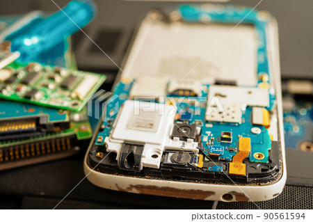Repairing and upgrade mobile phone, electronic, computer hardware and technology concept. Repairing and upgrade mobile phone, electronic, computer hardware and technology concept. 90561594