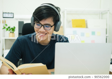 Young man study in front of the laptop computer at home Young man study in front of the laptop computer at home 90562000