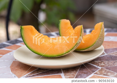 Cut melon placed on the terrace seat melon Cut melon placed on the terrace seat melon 90563010