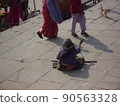 Indian Varanasi old woman begging 90563328