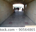 People walking in an Indian marble tunnel 90564865